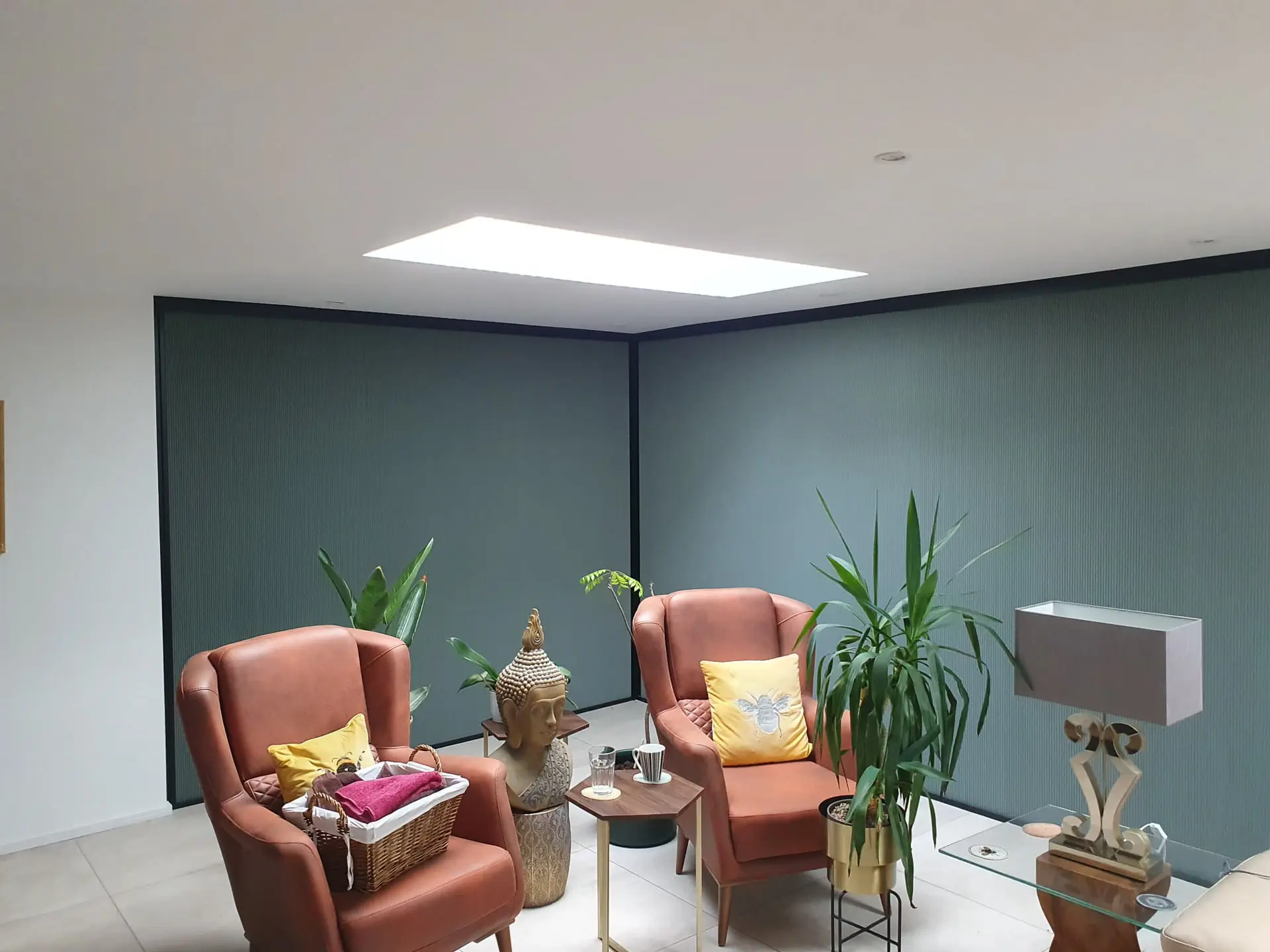 Dark pleated privacy shades installed across a corner glass opening